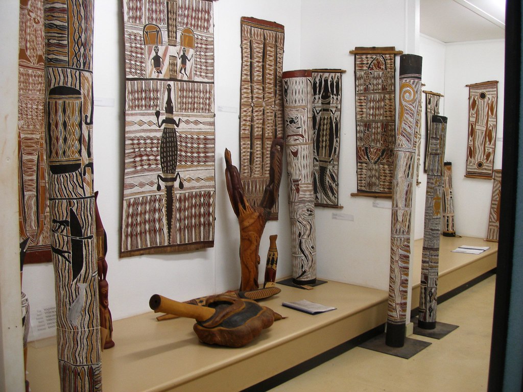 A photo of the Yirrkala Art Centre, showcasing vibrant Indigenous artworks displayed both indoors and outdoors. 