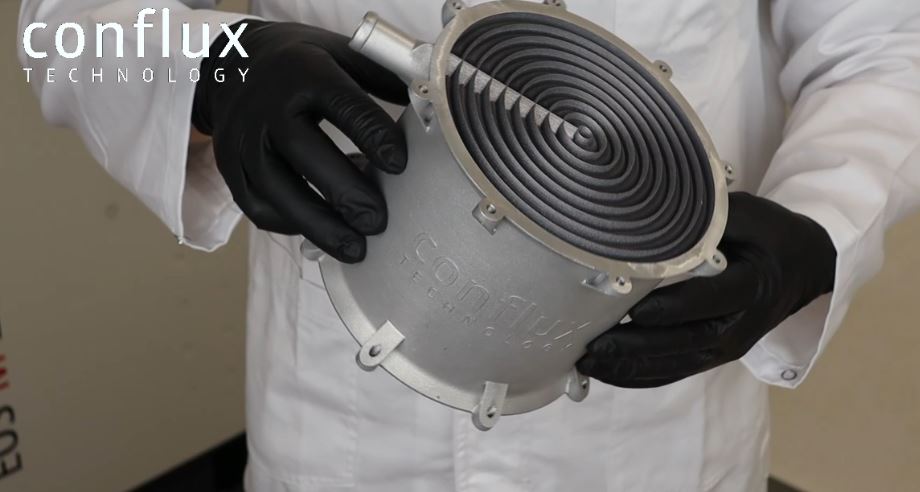 Engineer holding a Conflux Technology WCAC Heat Exchanger