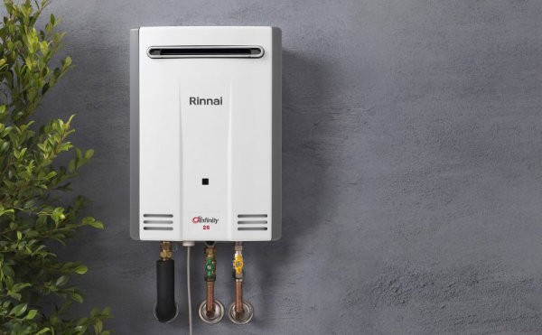 Rinnai Infinity CF26 instant hot water unit on rendered wall