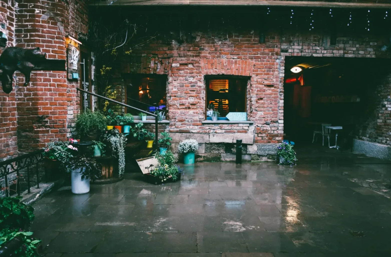 brick home with flooded courtyard 