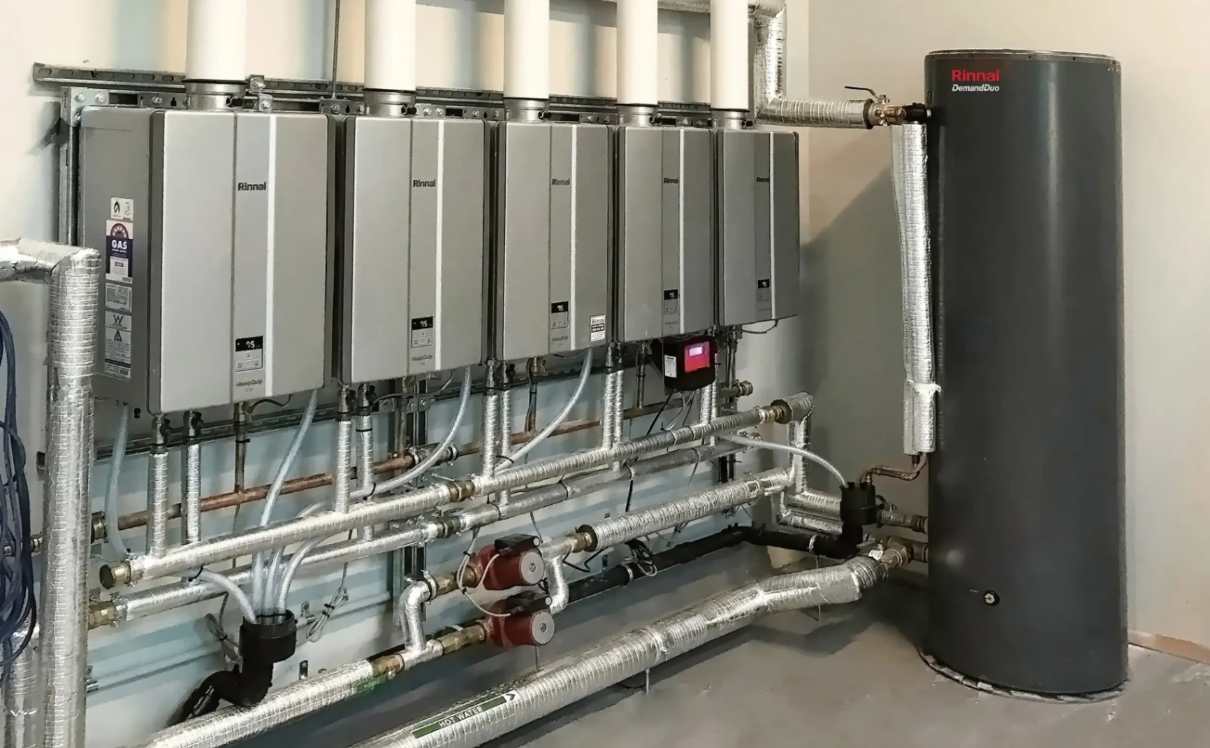 Rinnai commercial gas hot water system with 4 systems and commercial flue
