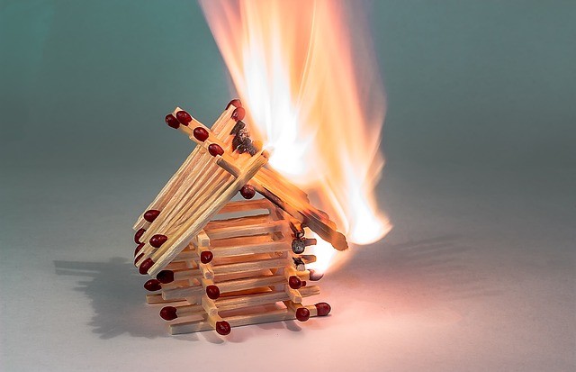 Matches in shape of house on fire
