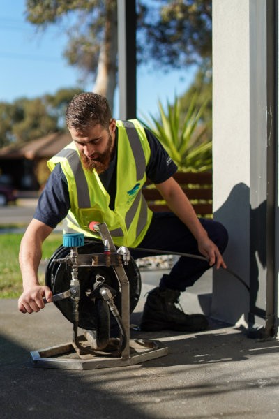 MPM Plumber using CCTV drain camera to pinpoint pipe blockage and clear blocked pipe