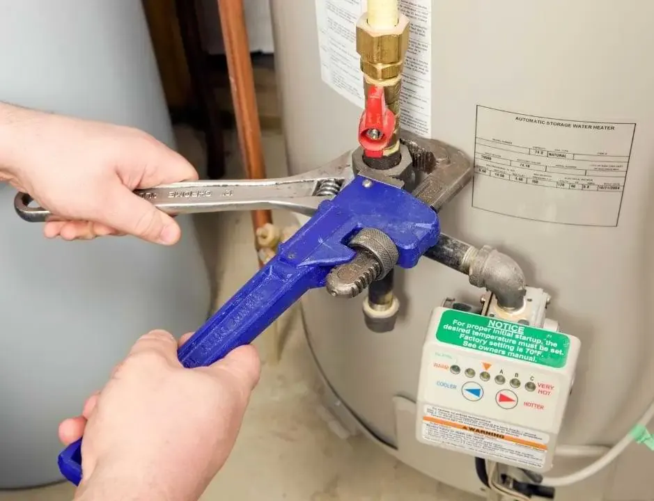 technician installing a gas heater