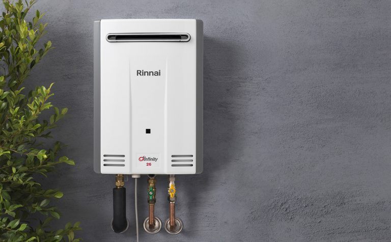 Rinnai Infinity instant hot water unit on rendered wall