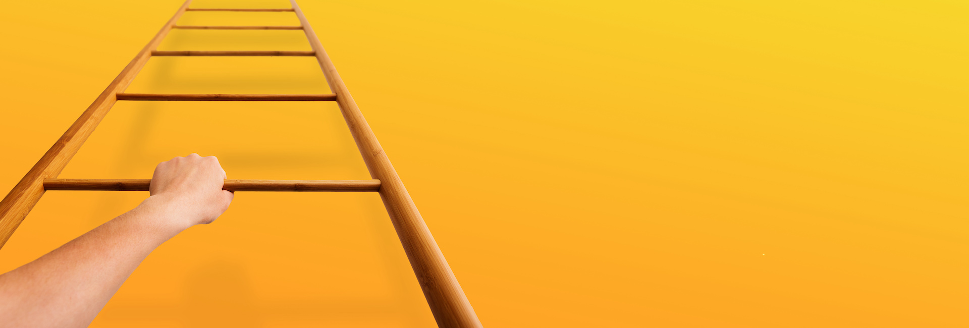 Woman climbing ladder with yellow background