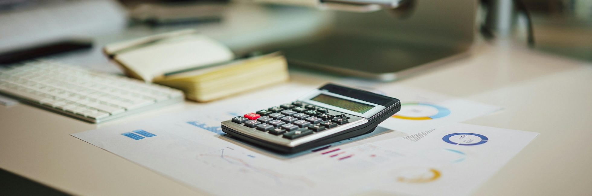 Tax Superannuation Image Calculator on desk with financial documents