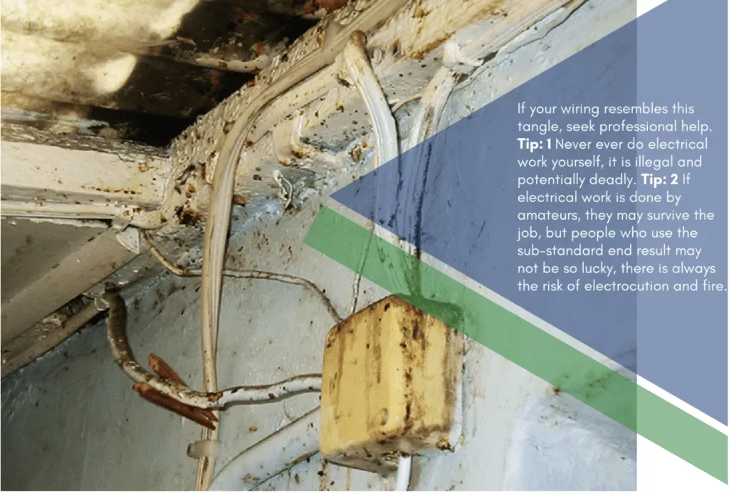Corroded wiring and electrical box with burn marks above. Extremely unsafe electrical wiring