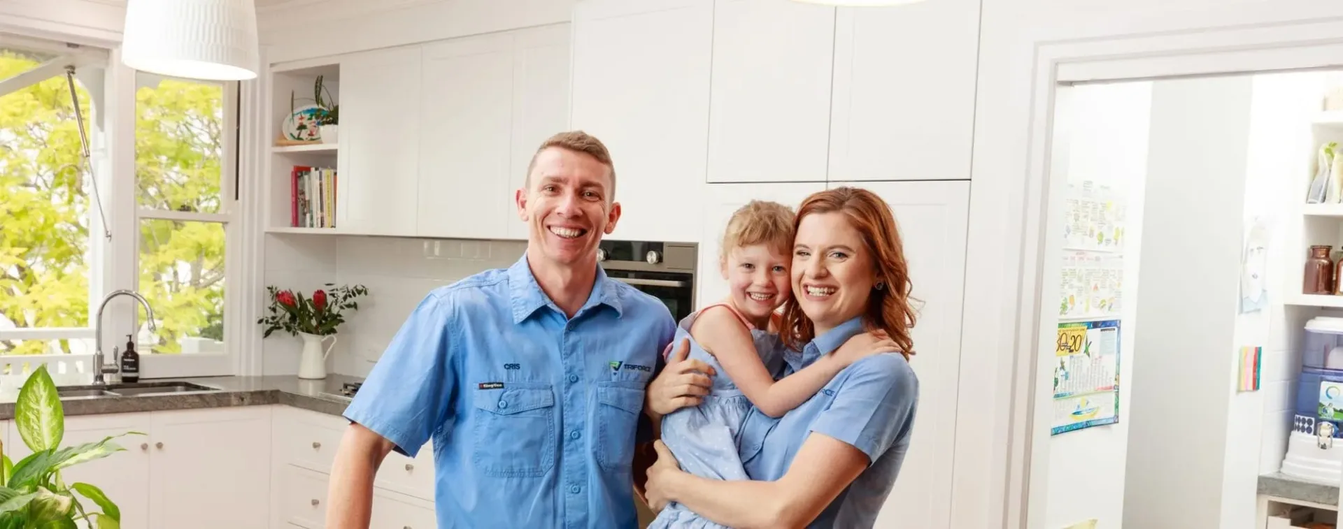 Triforce Electrical & Air team after installing new oven stood in kitchen