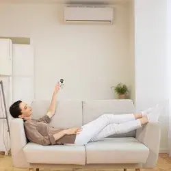 lady with AC remote