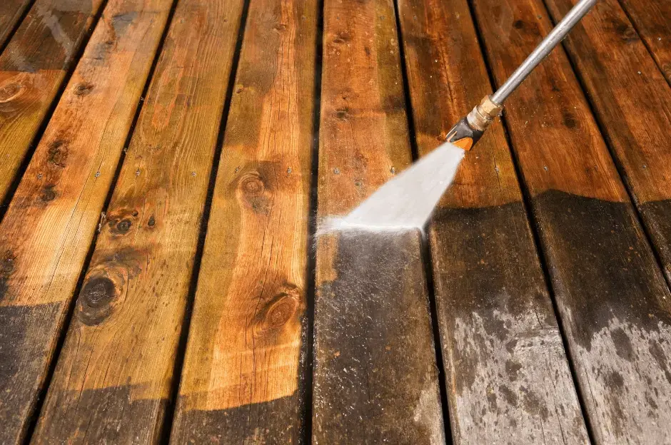 Pressure washing of timber deck. pristine like-new timber after pressure cleaning