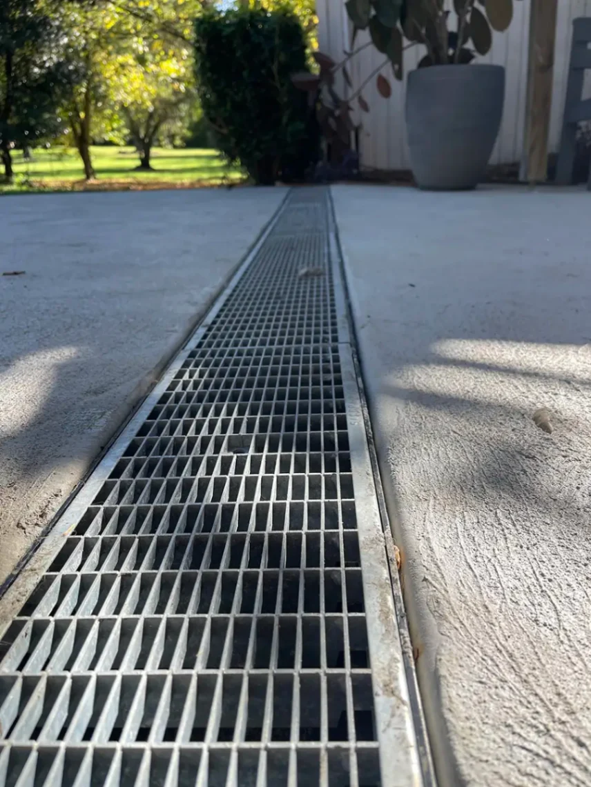 Channel drain with grate on top