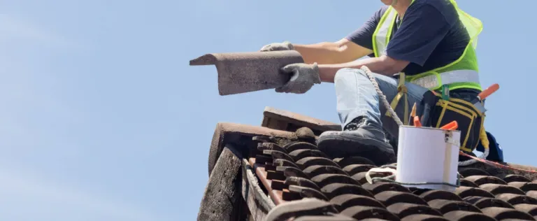 roof plumber fixing a roof leak