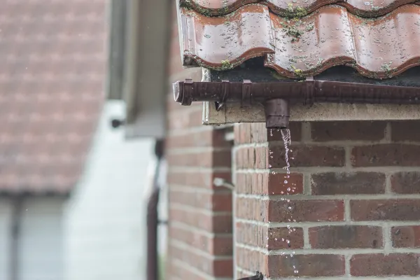 Leaking downpipe causing structural damage needing a proper drainage system