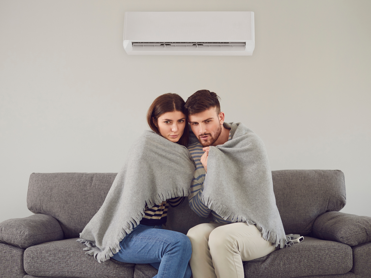 People getting too cold because air conditioner is blowing on them