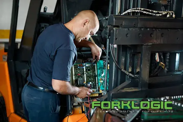 Forklogic technician servicing and performing repairs om a forklift