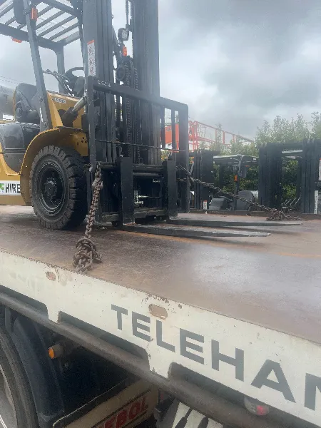 Side view forklift on truck tray