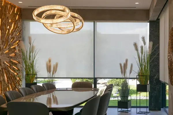 Sunscreen roller blinds designed and made for customised fit for wide and high windows in a dining or office meeting space to block out the sun and heat, whilst still allowing light to come in. The best of both worlds!