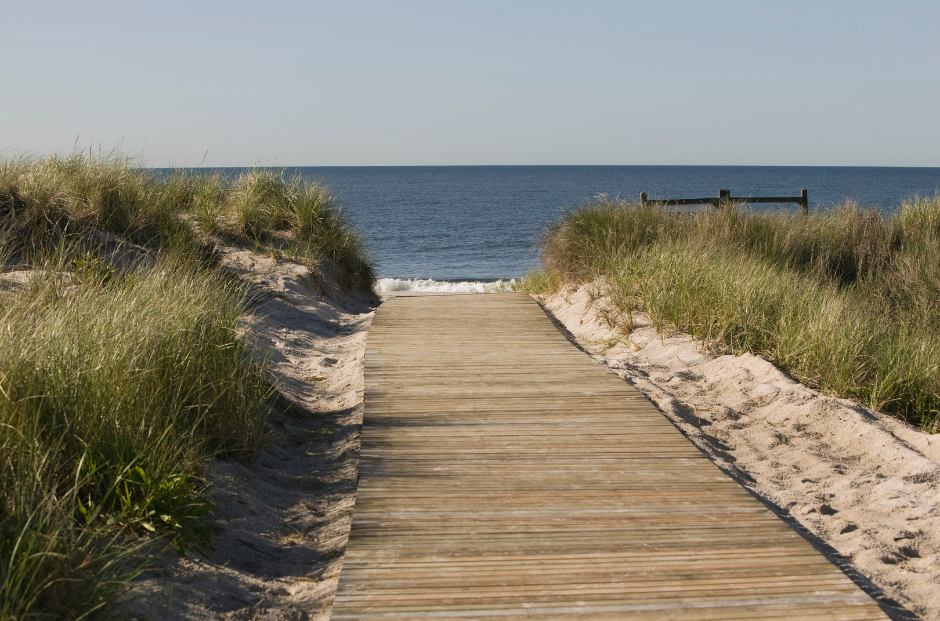 Fully repaired and restored timber boardwalk leading to the water