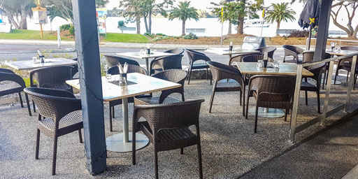 Sanitising tables & chairs for customers