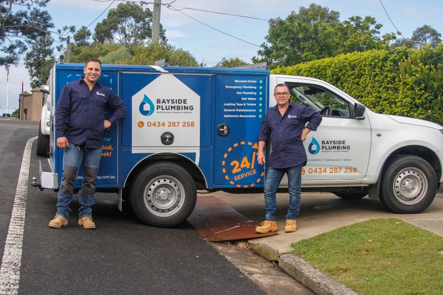 Bayside plumbers next to work van