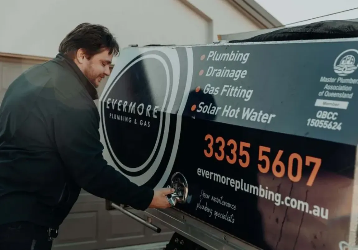 Evermore plumber next to work van