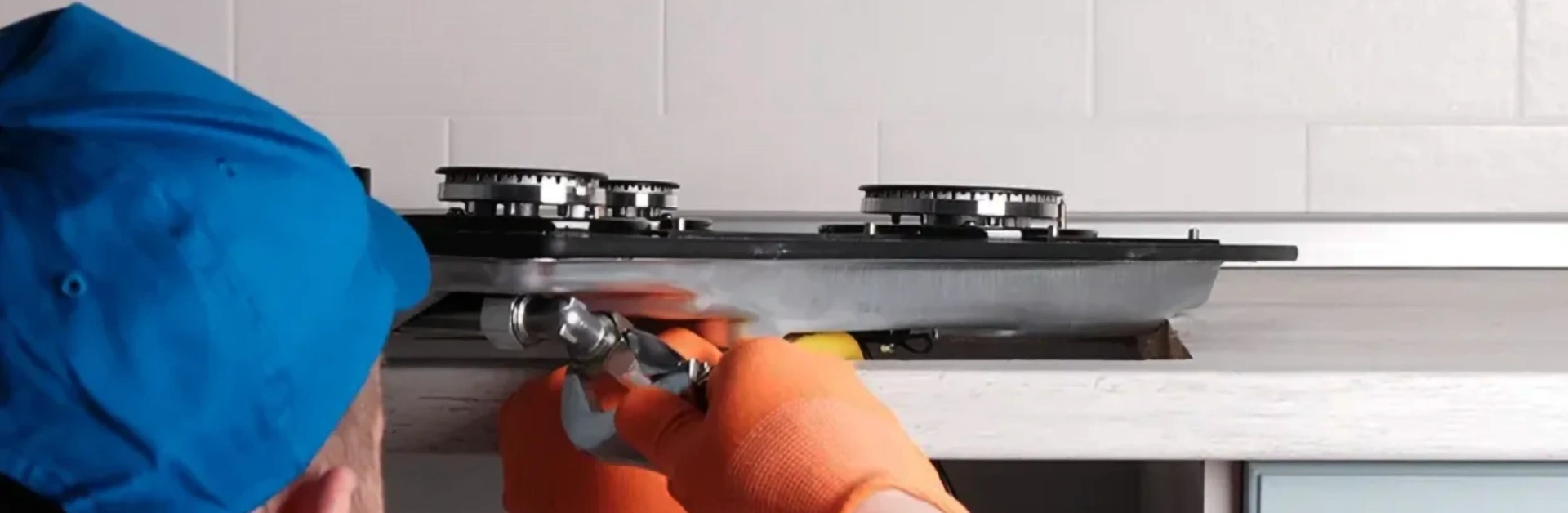 technician installing a gas cooktop
