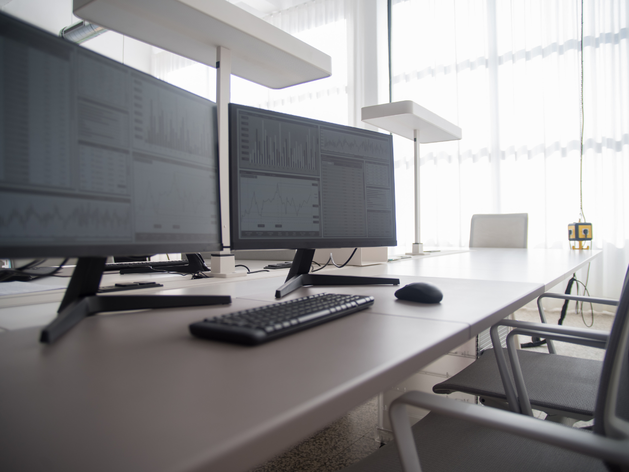 Office desk with computer and mouse