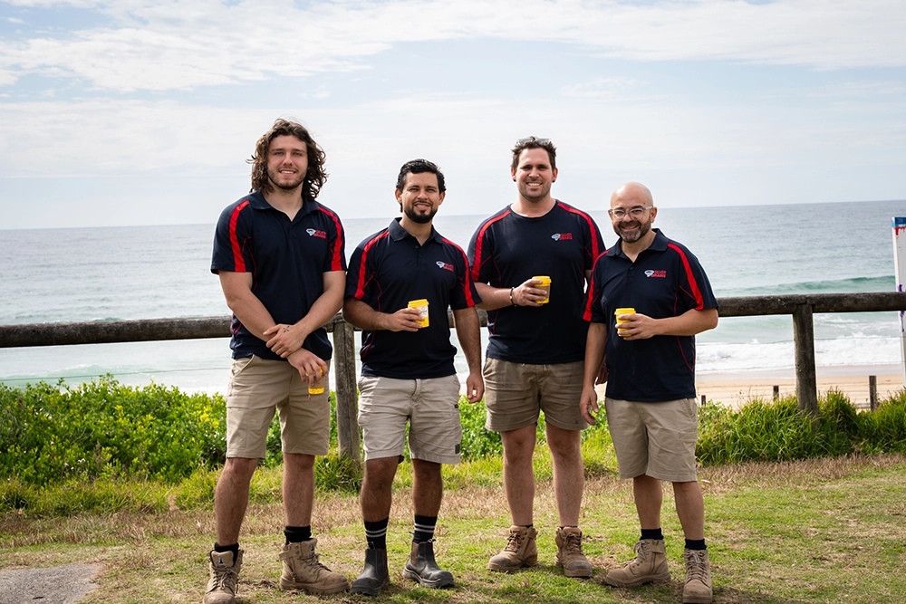 Team members at the beach