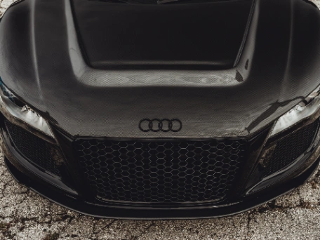 Audi e-tron being charged by Level 2 home charging station installation