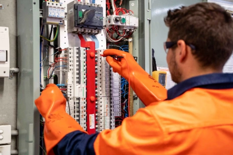 Commercial switchboard assessment being performed by qualified electrician. If you don't know your Maximum Demand, you&rsquo;re just counting down the days until a main fuse fails.