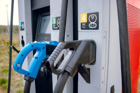 Different types of ev charging plugs at ev charger station including CCS and CHAdeMO for DC charging