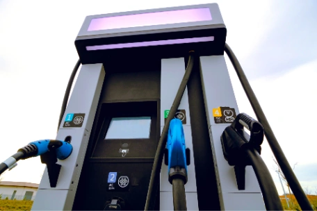 Different types of ev charging plugs at ev charger station including CCS and CHAdeMO for DC charging