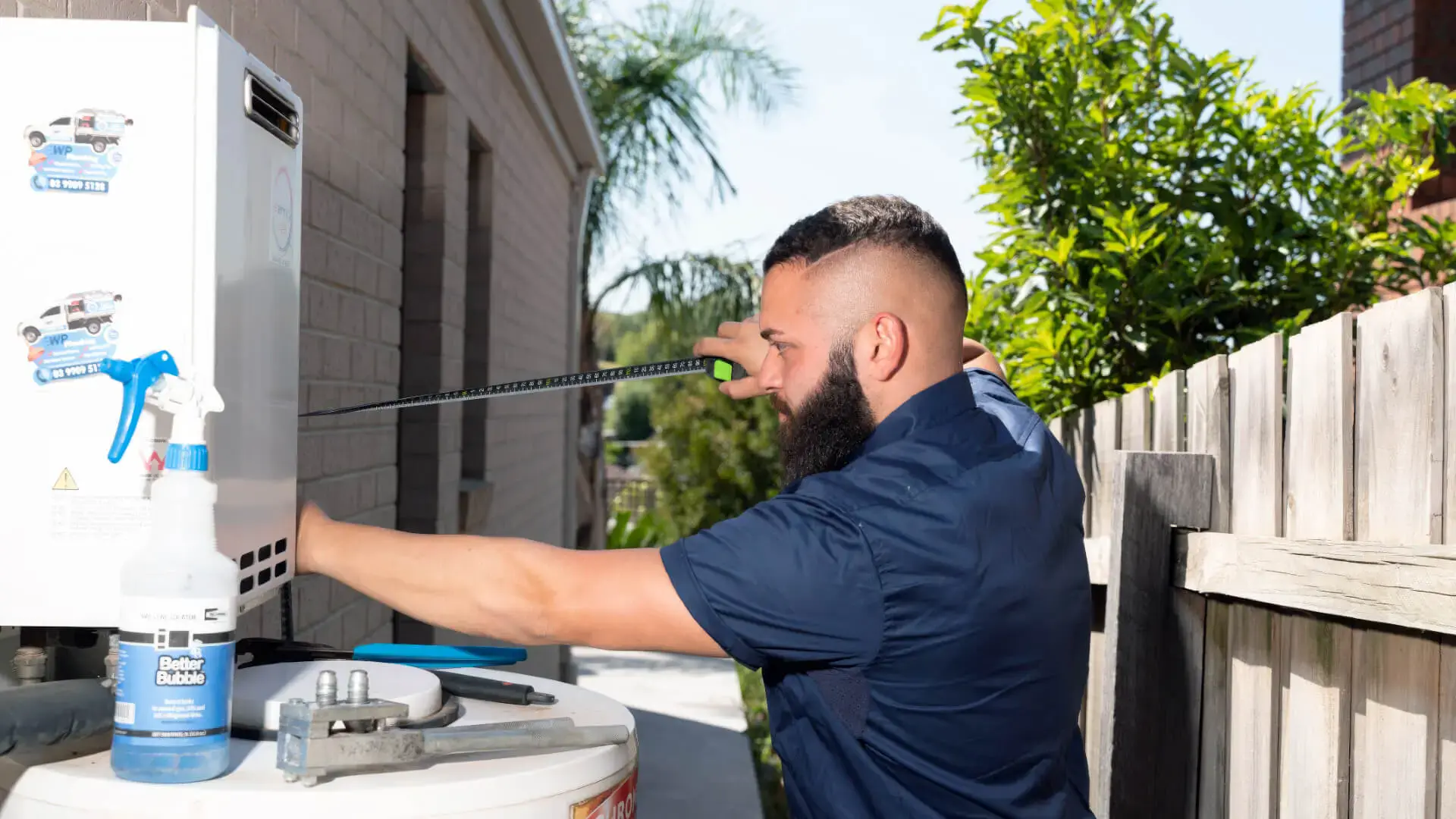 Our plumbers repairing a hot water system