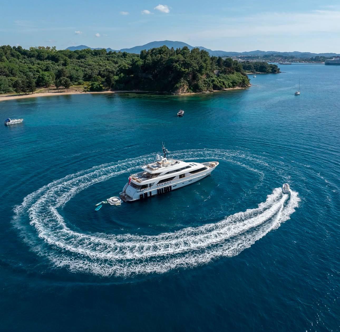 Yacht crew members socializing and networking in a beautiful outdoor setting