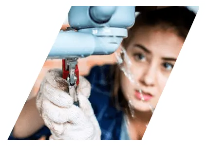 Woman taking apart plumbing in her bathroom under the sink