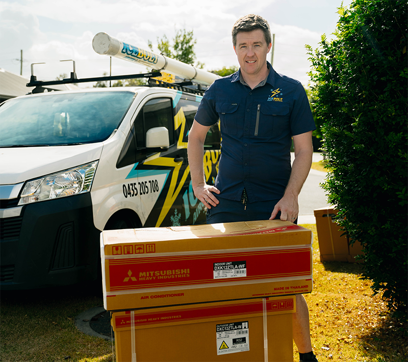 Icebolt technician delivering a split system air conditioner to a Brisbane home
