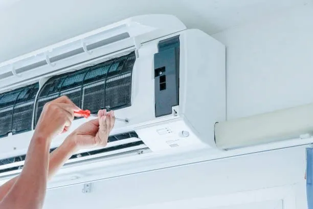 Icebolt technician cleaning air conditioning filters in Kingston