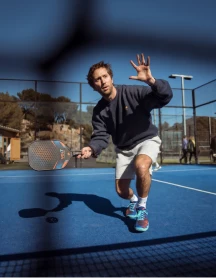 Coach demonstrating a forehand drive